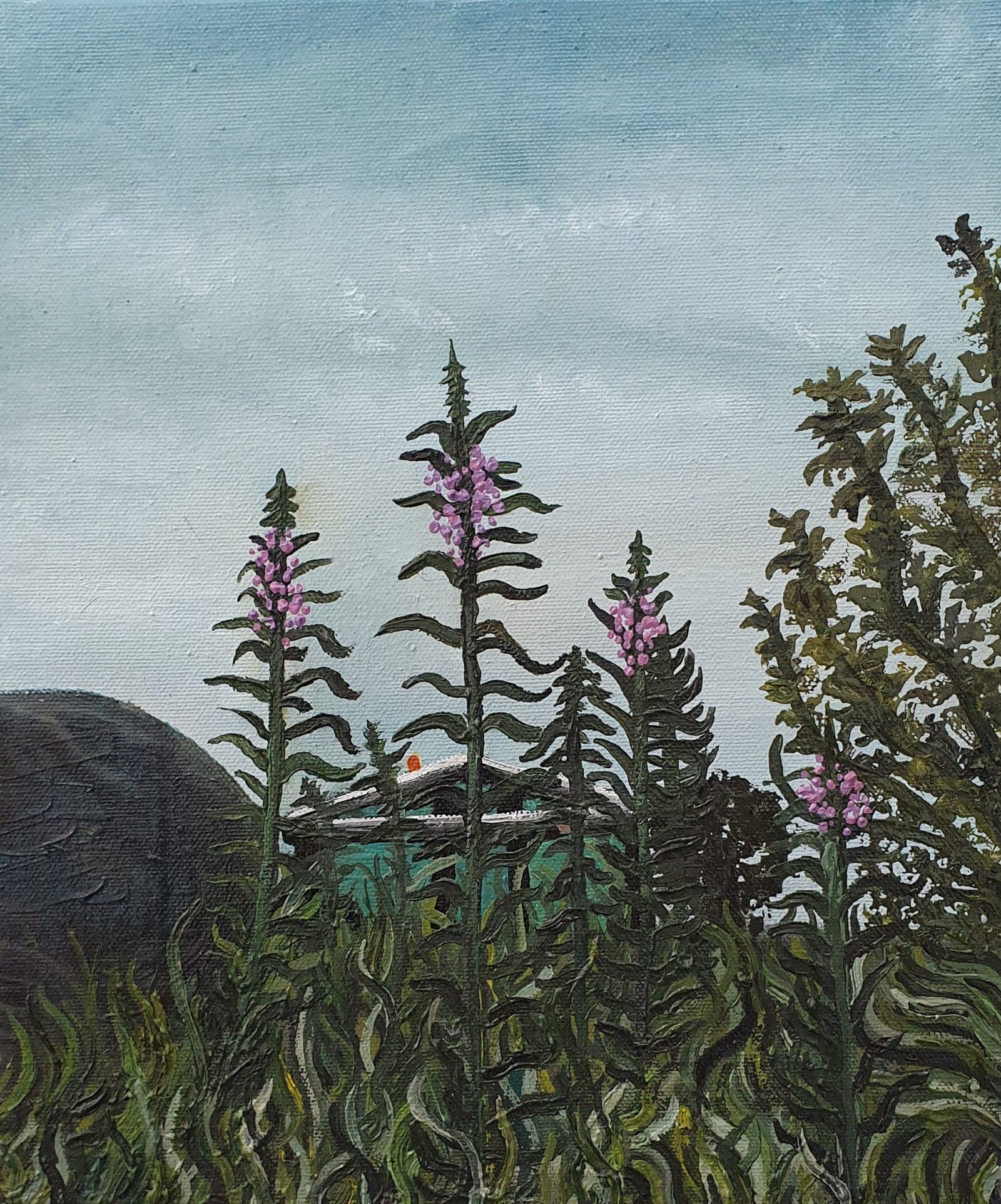 Pink fireweed flowers rise above dense green foliage beneath a pale blue sky.